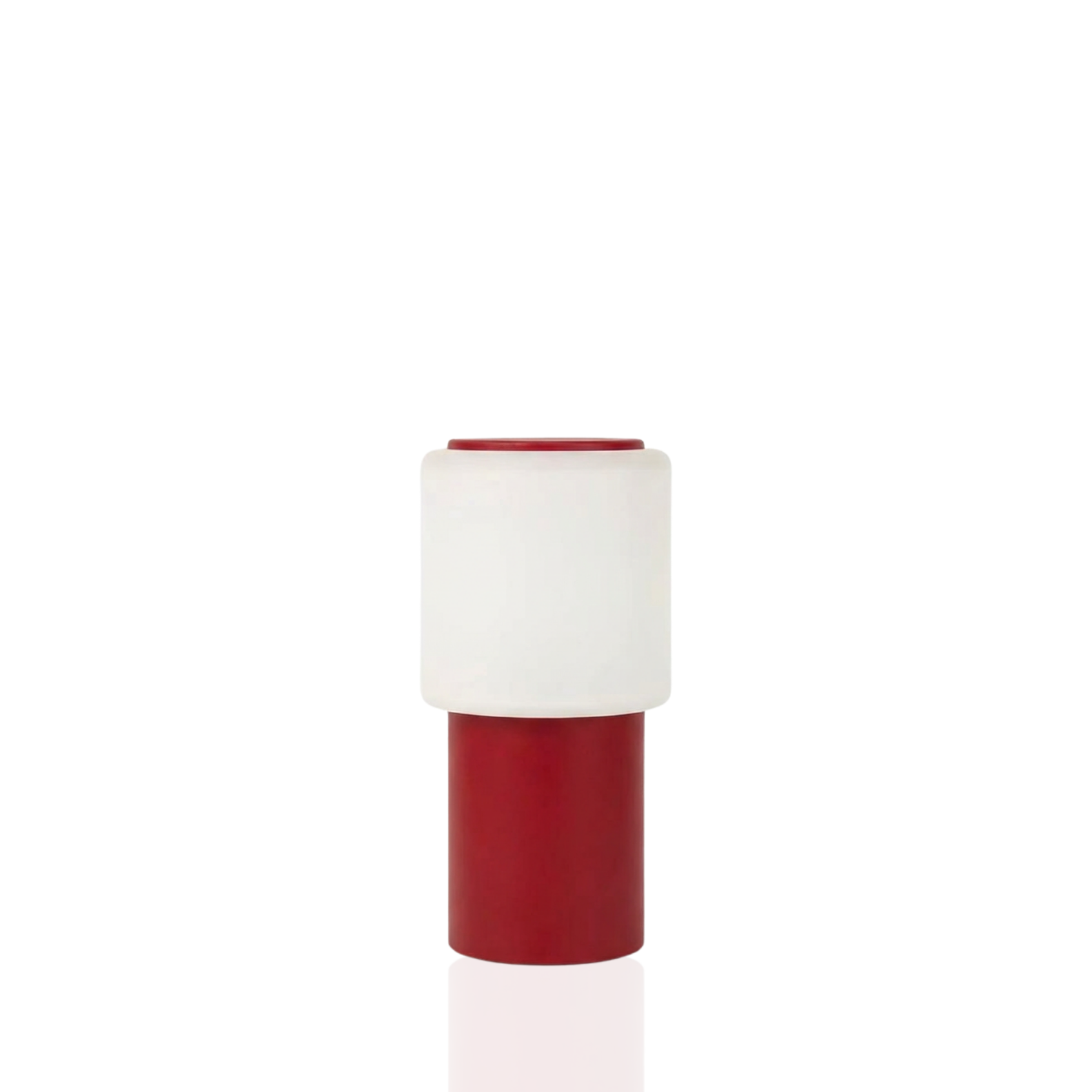 Sole Mio Table Lamp in red matte, creating a warm sunset ambiance.