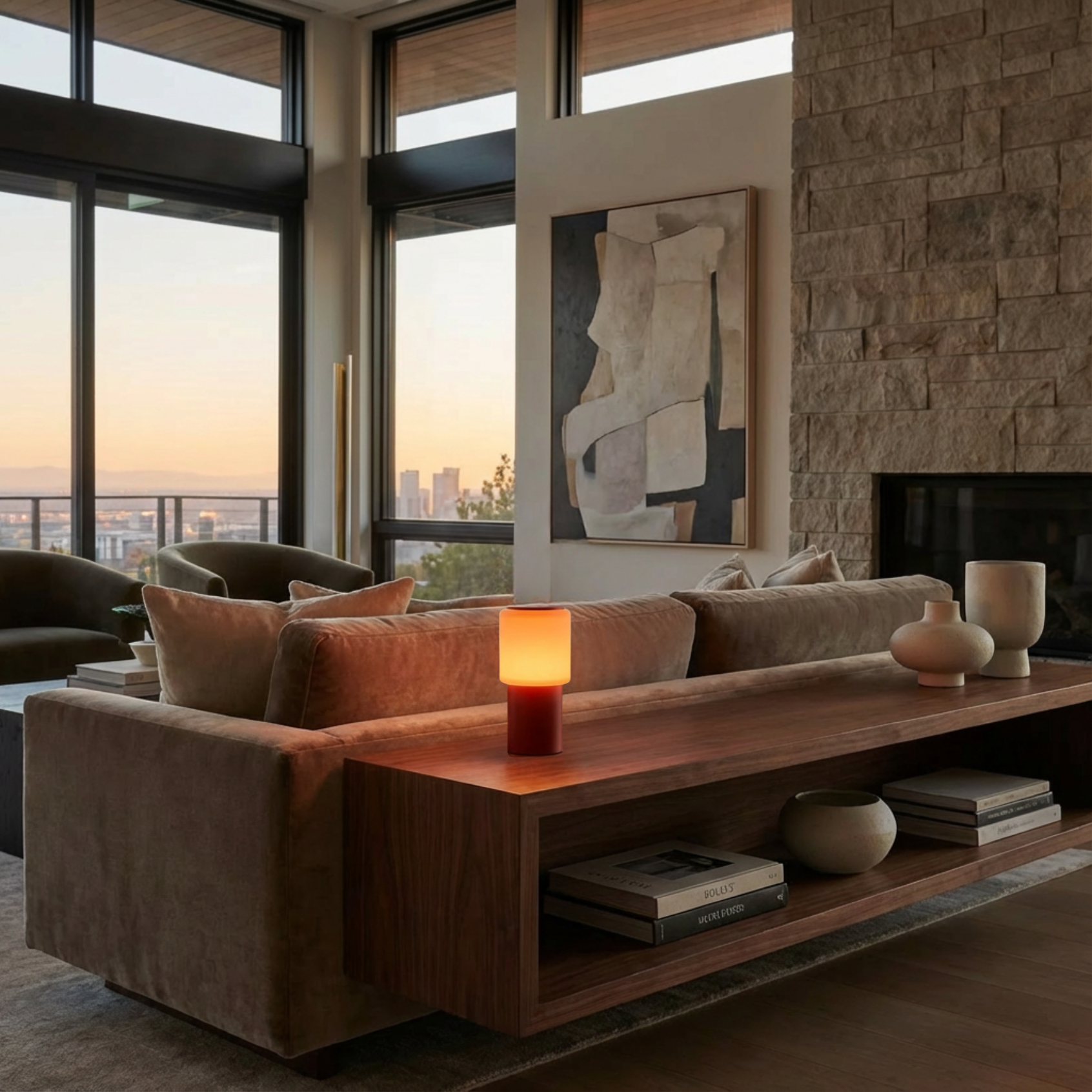 Sole Mio Table Lamp with a matte red base and warm glowing shade, placed on a wooden console in a modern living room.