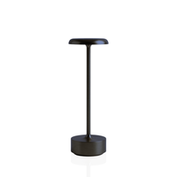 Helia Table Lamp in black with a sleek, modern design and a brushed gold accent.